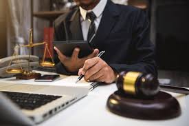 Patent lawyer or patent attorney at LAW FIRM OF DAYREL SEWELL NYC reviewing intellectual property documents.