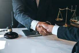 Experienced patent lawyer reviewing legal documents to protect intellectual property rights – The Law Firm of Dayrel Sewell