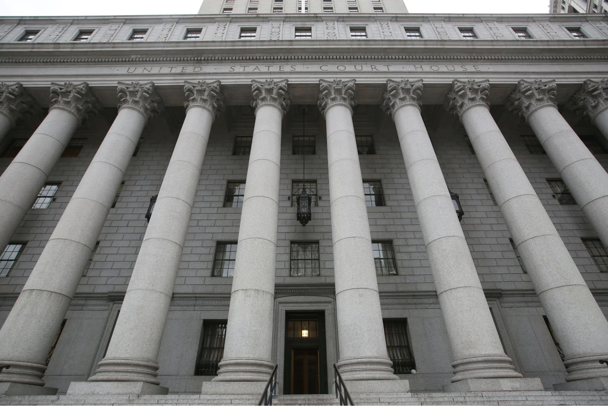 Columns of a United States Court House seen from below